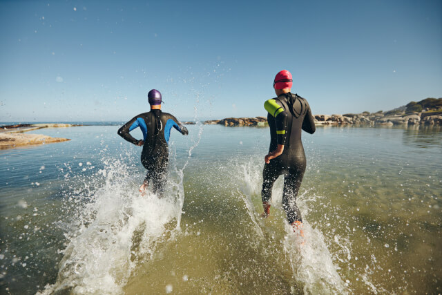 Runners entering the sea during a triathlon