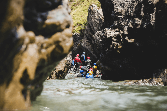 A group of people coasteering in Pembrokeshire