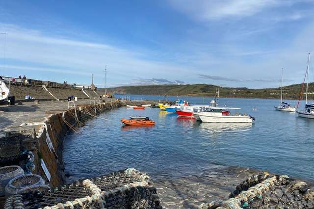 Boats moored up at New Quay Harbour in Wales.